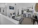 Modern living room and kitchen area with white walls, stylish decor, and stainless steel appliances at 4176 Zenobia St, Denver, CO 80212