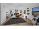 Well-lit main bedroom with large windows, hardwood floors and minimalist decor at 4176 Zenobia St, Denver, CO 80212