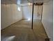 Unfinished basement with a concrete floor, exposed ceiling, and a small window for natural light at 16835 E Harvard Pl, Aurora, CO 80013