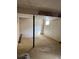 Unfinished basement with cement walls, and single support beam and window at 16835 E Harvard Pl, Aurora, CO 80013