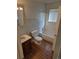 Full bathroom with tub and shower, single sink vanity and new wood-style flooring at 16835 E Harvard Pl, Aurora, CO 80013