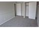 Bedroom with closet, window, and new carpet and fresh paint at 16835 E Harvard Pl, Aurora, CO 80013