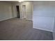 Carpeted bedroom view showcasing a closet with mirrored doors and a white door at 16835 E Harvard Pl, Aurora, CO 80013