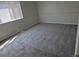Comfortable bedroom with neutral walls, carpet and a large window at 16835 E Harvard Pl, Aurora, CO 80013