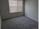 Bright bedroom with carpet and window, offering ample natural light at 16835 E Harvard Pl, Aurora, CO 80013