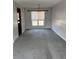 Cozy dining room area featuring gray carpet and a classic chandelier fixture at 16835 E Harvard Pl, Aurora, CO 80013