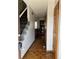 Inviting entryway features hardwood floors, staircase and access to kitchen at 16835 E Harvard Pl, Aurora, CO 80013