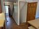 View of hallway with stairs, laminate flooring, and neutral paint at 16835 E Harvard Pl, Aurora, CO 80013