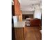 Spacious kitchen featuring a gas stove, wood cabinets and hardwood floors at 16835 E Harvard Pl, Aurora, CO 80013