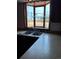 Kitchen features stainless steel sink with a large window with outdoor view at 16835 E Harvard Pl, Aurora, CO 80013