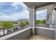 View from private balcony showcasing the neighborhood with lush trees and well-maintained buildings at 5255 Memphis St # 224, Denver, CO 80239
