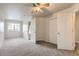 Inviting bedroom with neutral colors, plush carpet, ceiling fan, and ample closet space at 5255 Memphis St # 224, Denver, CO 80239