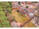 Aerial view of the property showcasing the spacious backyard with patio, deck, and shed at 7148 S Dahlia Ct, Centennial, CO 80122