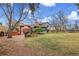 Expansive backyard with a patio, hot tub, shed, and mature trees for relaxing and entertaining at 7148 S Dahlia Ct, Centennial, CO 80122