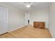 Spacious bedroom with hardwood floors, ceiling fan, and a dresser at 7148 S Dahlia Ct, Centennial, CO 80122