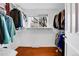 Walk-in closet with shelving and hanging rods, providing ample storage space at 7148 S Dahlia Ct, Centennial, CO 80122