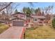 Charming two-story home with a well-manicured front yard and attached two car garage at 7148 S Dahlia Ct, Centennial, CO 80122