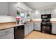 Well-lit kitchen with grey cabinets, granite countertops, stainless steel appliances, and a large window at 7148 S Dahlia Ct, Centennial, CO 80122