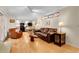 Cozy living room with open layout, hardwood floors, fireplace, and access to the kitchen at 7148 S Dahlia Ct, Centennial, CO 80122