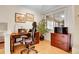 Bright office space with wooden desk, large window, and ample natural light at 7148 S Dahlia Ct, Centennial, CO 80122