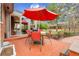 Outdoor patio featuring a dining set and views into the sun room at 7148 S Dahlia Ct, Centennial, CO 80122