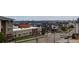 Community view of townhomes, nicely landscaped with views of the city in the distance at 10154 Belvedere Loop, Lone Tree, CO 80124
