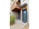 Townhome entrance featuring house number 10154, gray door, and a sheltered entryway at 10154 Belvedere Loop, Lone Tree, CO 80124
