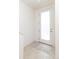 Entryway featuring neutral tile floors, a glass front door, and ample natural light at 10154 Belvedere Loop, Lone Tree, CO 80124