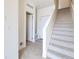 Bright entryway with tile flooring, a carpeted staircase, and entry closet at 10154 Belvedere Loop, Lone Tree, CO 80124