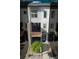 Exterior view of a contemporary townhome featuring modern design elements and a well-maintained front yard at 10154 Belvedere Loop, Lone Tree, CO 80124