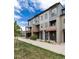 Modern townhome exteriors featuring sleek design, private balconies, and well-manicured landscaping, enhancing curb appeal in a vibrant community at 10154 Belvedere Loop, Lone Tree, CO 80124