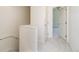Bright hallway featuring neutral walls, plush carpeting, and white doors leading to various rooms, enhancing the home's modern appeal at 10154 Belvedere Loop, Lone Tree, CO 80124