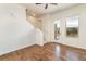 Well-lit living room featuring hardwood floors, staircase, and outdoor access at 10154 Belvedere Loop, Lone Tree, CO 80124