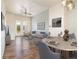 Stylishly furnished living area features a dining table, hardwood floors, and cozy seating at 10154 Belvedere Loop, Lone Tree, CO 80124