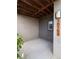Outdoor patio space featuring brick and wood accents, sheltered design, and unit number display at 10154 Belvedere Loop, Lone Tree, CO 80124