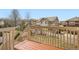 The back deck overlooks a charming yard enclosed with a white picket fence at 3523 Brushwood Dr, Castle Rock, CO 80109