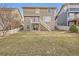 Exterior view of backyard with a small deck and stairs on a sunny day at 3523 Brushwood Dr, Castle Rock, CO 80109