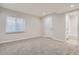 This bedroom includes neutral walls, plush carpeting, and ample natural light at 3523 Brushwood Dr, Castle Rock, CO 80109