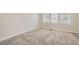 Cozy bedroom with neutral carpet and a bright, sunny window at 3523 Brushwood Dr, Castle Rock, CO 80109