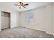Bedroom with carpet flooring, ceiling fan, closet, and window providing natural light at 3523 Brushwood Dr, Castle Rock, CO 80109