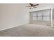 Bedroom with carpet flooring, ceiling fan and a window providing natural light at 3523 Brushwood Dr, Castle Rock, CO 80109