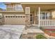 Close-up of home's front porch, stone accents, and attached garage at 3523 Brushwood Dr, Castle Rock, CO 80109