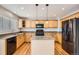 Kitchen with island, maple cabinets, and stainless steel appliances at 3523 Brushwood Dr, Castle Rock, CO 80109