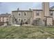 Backyard view of property with a green lawn and fenced-in patio area with outdoor furniture and grill at 14344 E Hawaii Cir # B, Aurora, CO 80012