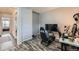 Functional bedroom featuring wood floors and set up as home office and a gaming station at 14344 E Hawaii Cir # B, Aurora, CO 80012