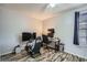 Bedroom furnished with a video game setup including monitors, gaming chair, and simulated steering wheel at 14344 E Hawaii Cir # B, Aurora, CO 80012