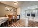 Open dining area flows into the kitchen and includes a dining table with bar seating at 14344 E Hawaii Cir # B, Aurora, CO 80012