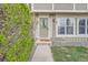Charming home's front entrance features a decorative door and well-maintained landscaping at 14344 E Hawaii Cir # B, Aurora, CO 80012