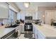 Modern kitchen features stainless steel appliances, a breakfast bar and lots of natural light at 14344 E Hawaii Cir # B, Aurora, CO 80012