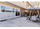 The backyard features a patio, swing, and exterior brick that enhance outdoor living and architectural appeal at 625 S Xenon Ct, Lakewood, CO 80228